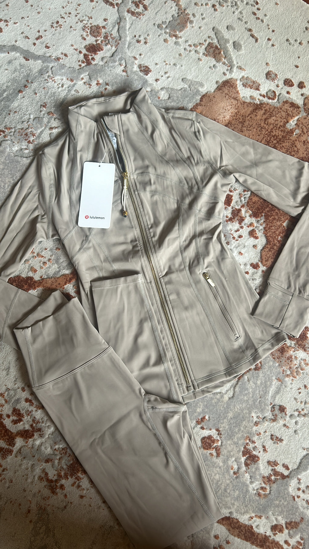 Tan and gold zip
