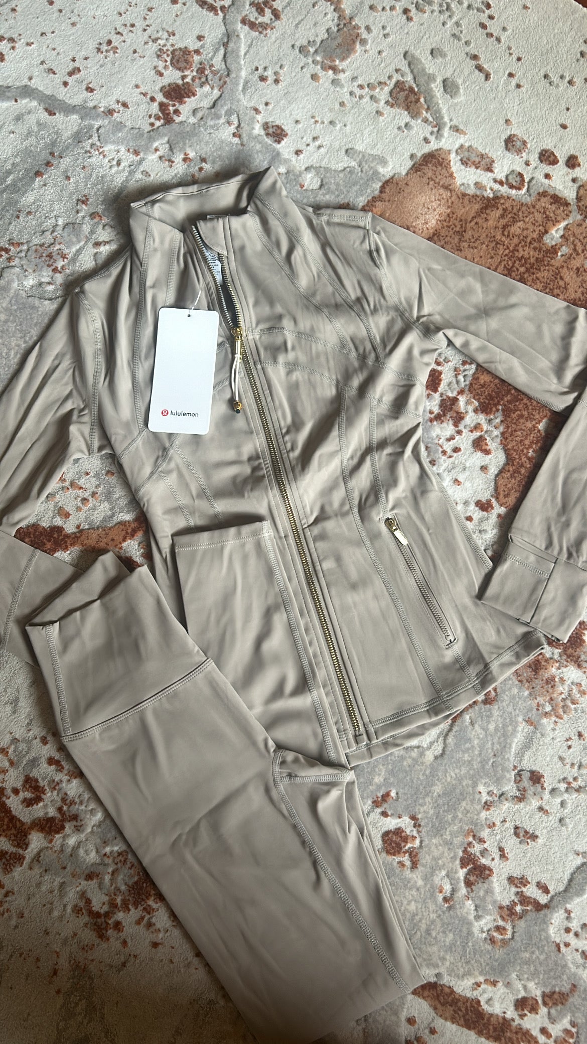 Tan and gold zip