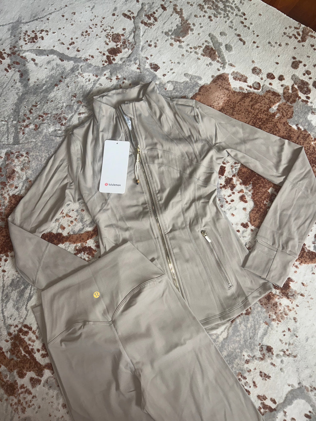 Tan and gold zip